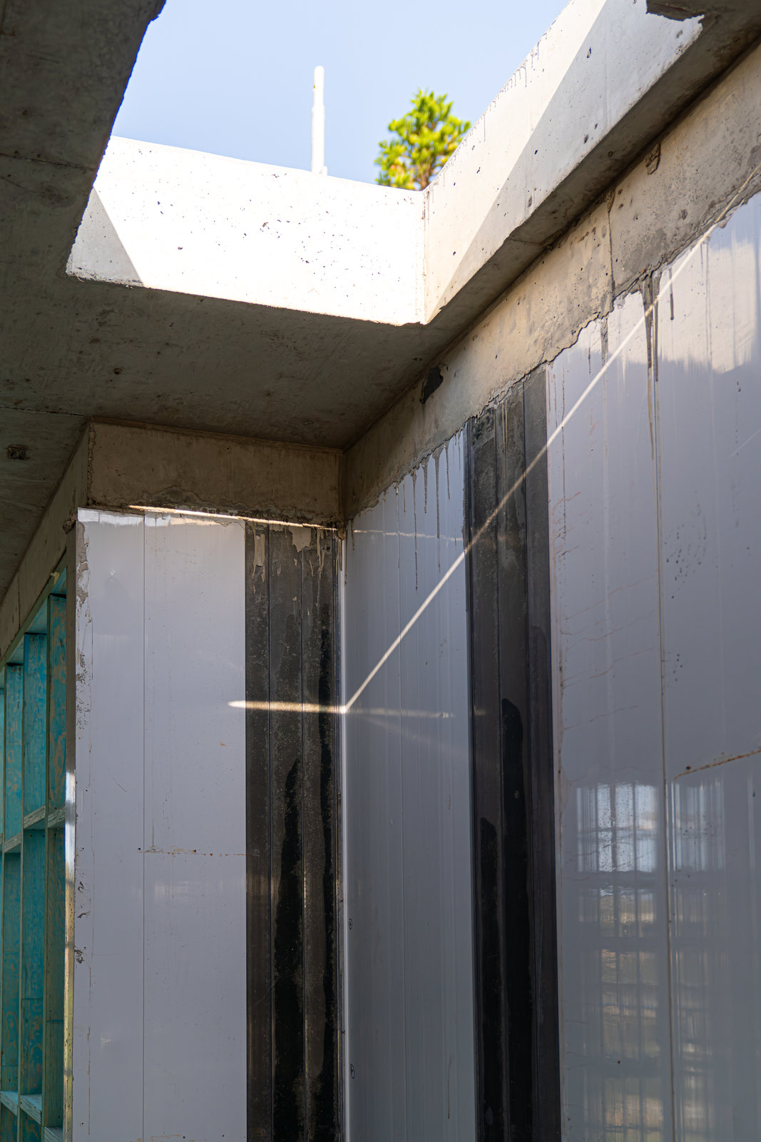 Clearform wall panels beneath a concrete slab and skylight opening